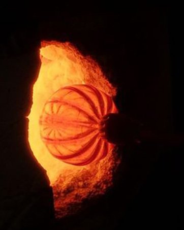 Glassblown pumpkin in furnace 